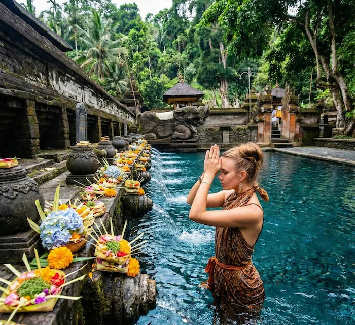 Woman at tirta EMpul on Goddess Retreat Bali .png
